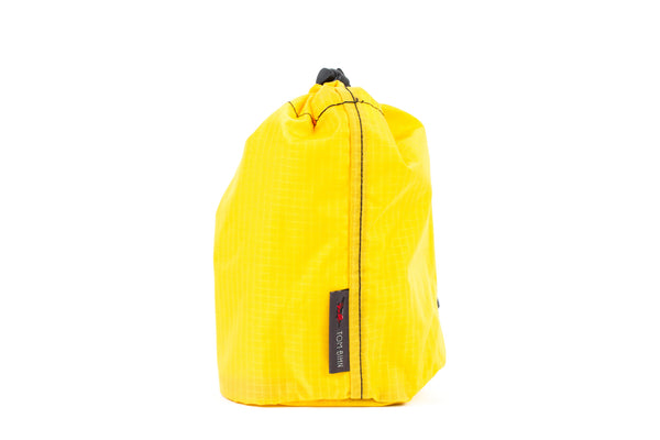 A Size 2 Marigold (yellow with light yellow grid) 210 Cerylon Travel Stuff Sack.